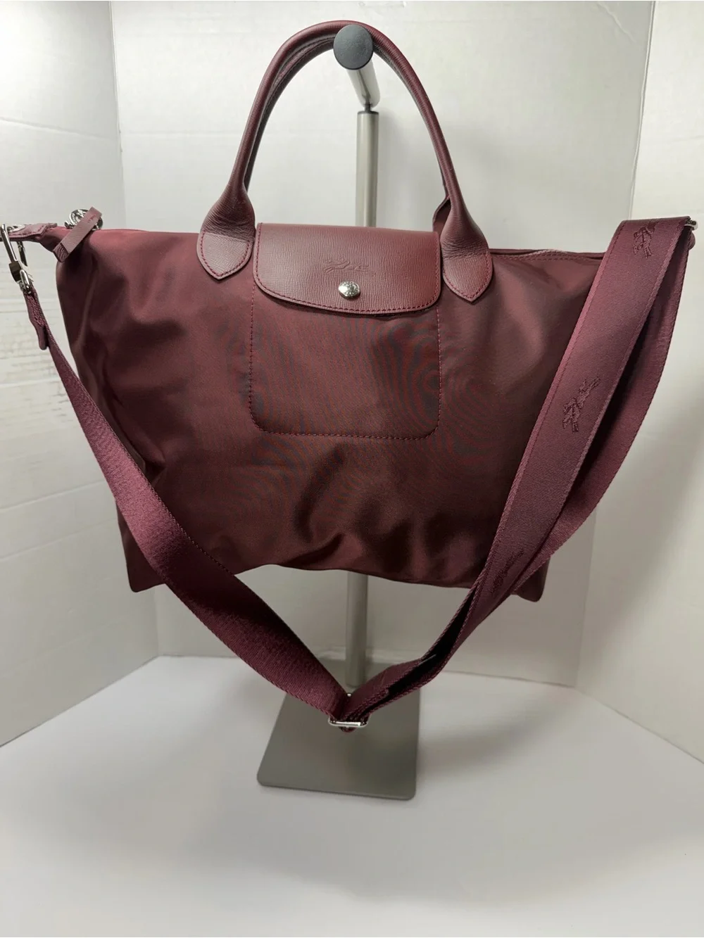 LONGCHAMP Burgundy medium Le Pliage tote from LONGCHAMP featuring leather trim